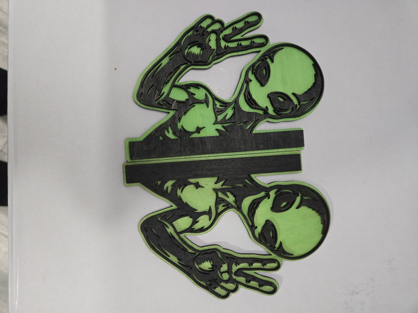 Mirrored green visitors · Misfit